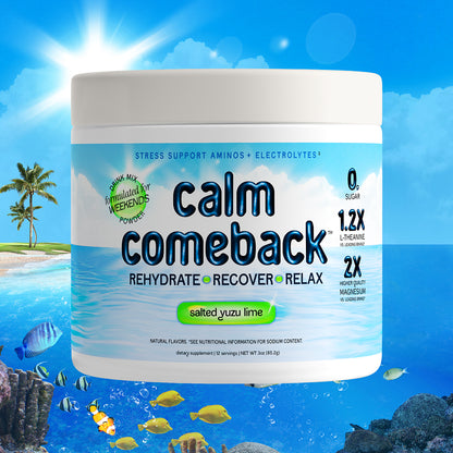 A white tub of Calm Comeback electrolyte powder with a tropical beach and ocean background. The label features blue ocean water graphics, and text indicating 'salted yuzu lime' flavor.