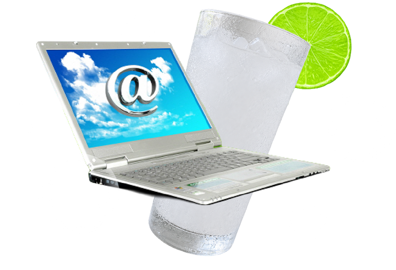 Laptop and glass of ice water with lime